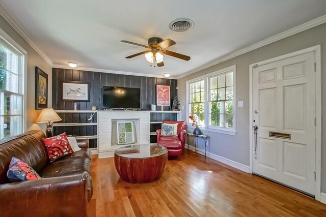 kitchen with light tile patterned flooring, white cabinets, exhaust hood, and appliances with stainless steel finishes