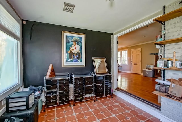 interior space with crown molding and hardwood / wood-style floors