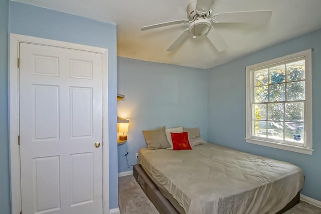 carpeted bedroom with ceiling fan