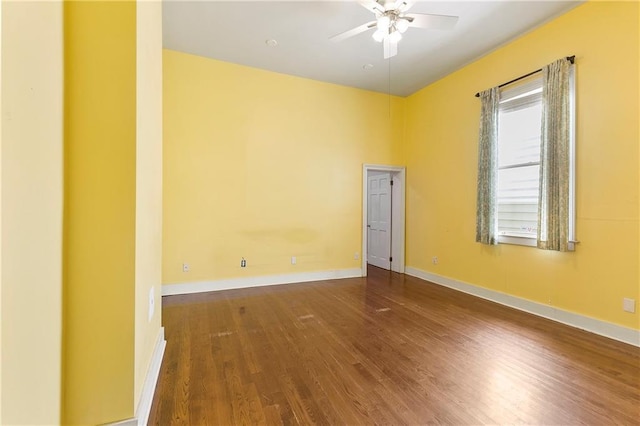 spare room with ceiling fan and wood-type flooring