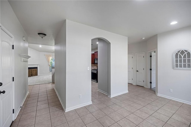 corridor featuring light tile patterned flooring