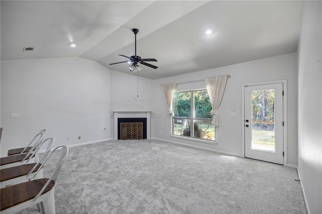 unfurnished living room with carpet flooring, ceiling fan, and lofted ceiling