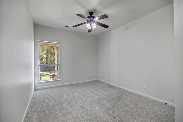 unfurnished room featuring ceiling fan and light carpet