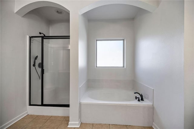 bathroom featuring tile patterned floors and plus walk in shower