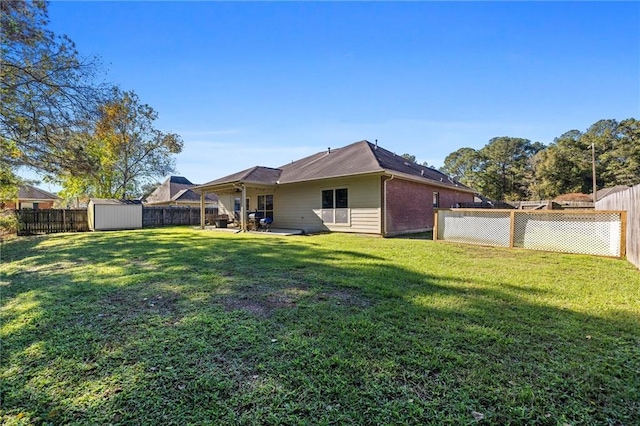 view of yard with a storage unit and a patio