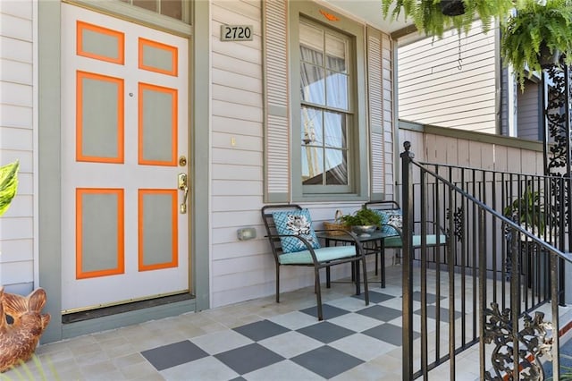 view of exterior entry with covered porch