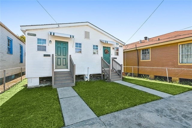 bungalow with a front yard