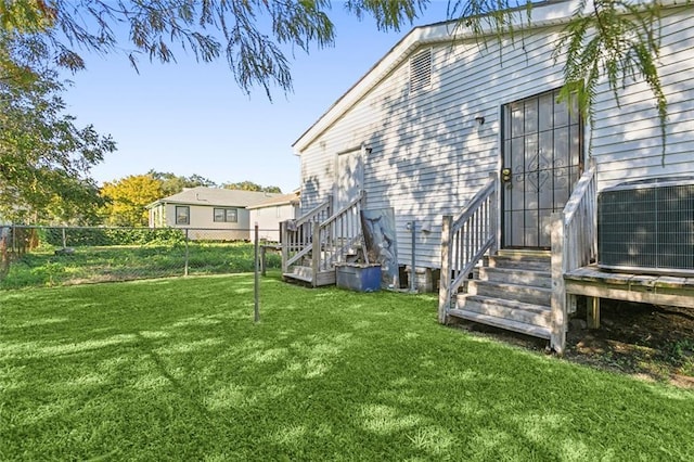 view of yard featuring central air condition unit