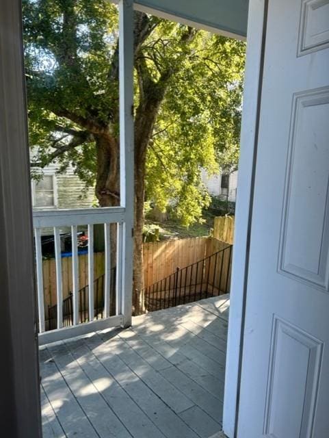 entryway with hardwood / wood-style floors