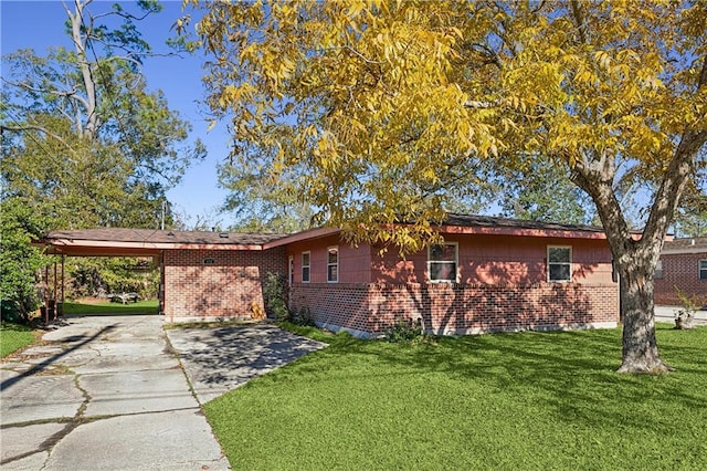 view of property exterior with a yard and a carport