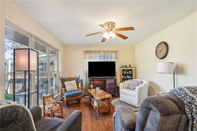 living room with dark hardwood / wood-style floors and ceiling fan