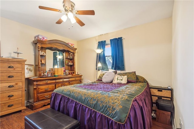 bedroom featuring ceiling fan and dark hardwood / wood-style flooring