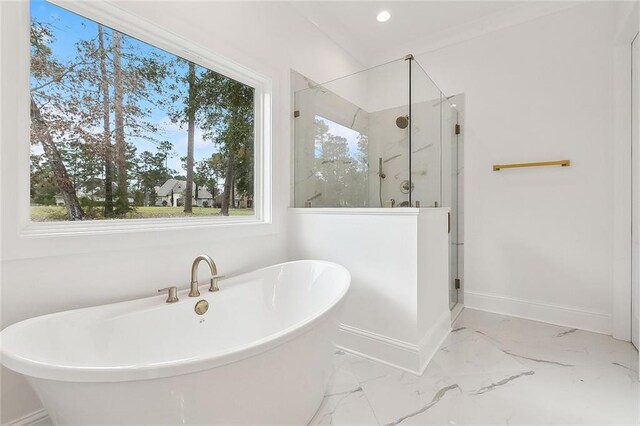 bathroom featuring independent shower and bath