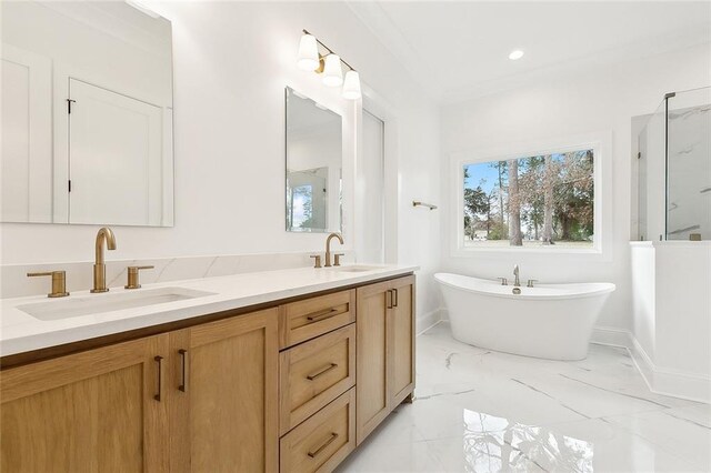 bathroom featuring independent shower and bath, ornamental molding, and vanity