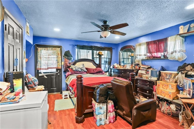 1910B Charbonnet St, New Orleans, LA 70117 - bedroom with wood finished floors and a textured ceiling