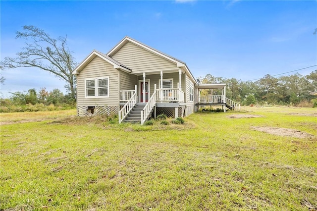 view of front of home with covered porch and a front yard