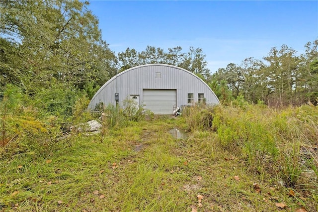 view of outbuilding with a garage