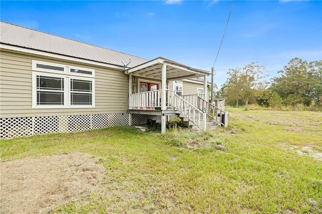 exterior space with a front lawn and covered porch