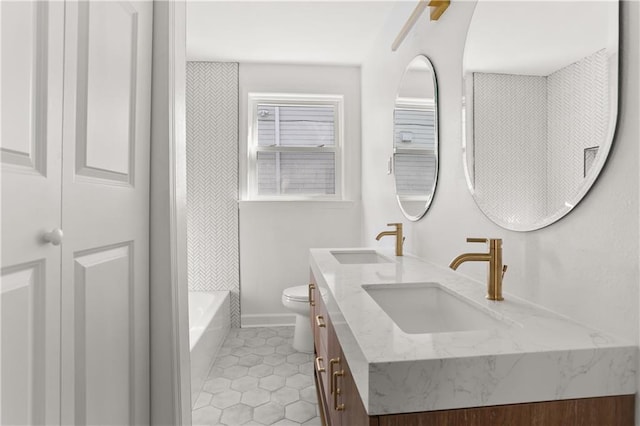 bathroom featuring tile patterned floors, vanity, and toilet