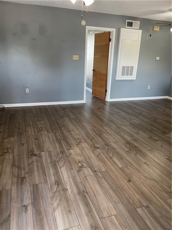 unfurnished room featuring hardwood / wood-style floors, a textured ceiling, and ceiling fan