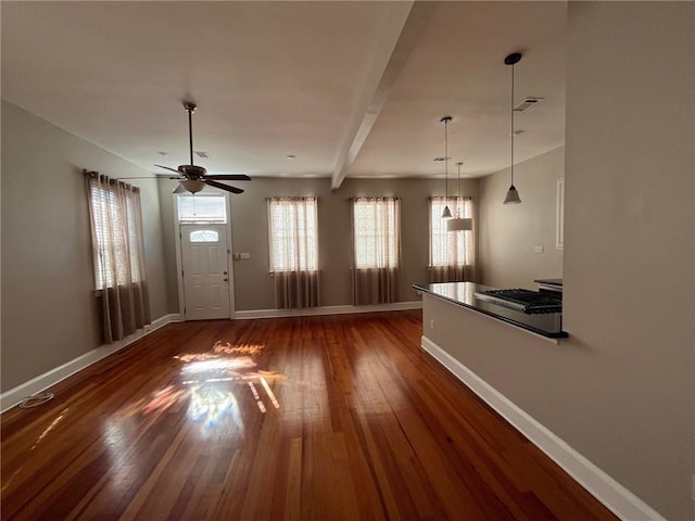 foyer with beam ceiling, ceiling fan, and dark wood-type flooring