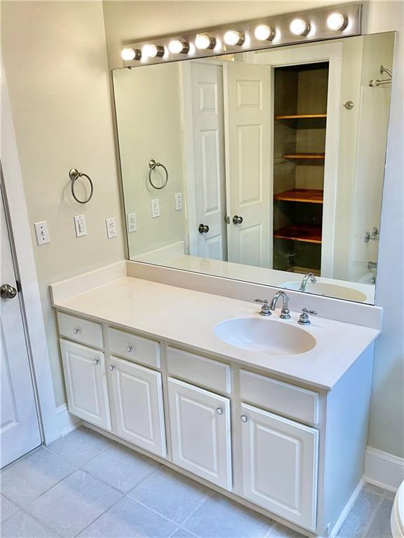 bathroom with tile patterned floors and vanity