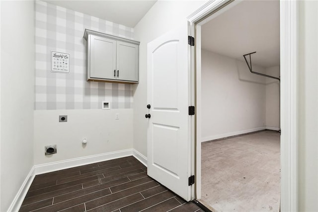 clothes washing area featuring cabinets, electric dryer hookup, hookup for a gas dryer, dark hardwood / wood-style floors, and hookup for a washing machine