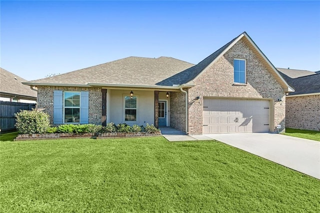 view of front of house with a front lawn and a garage