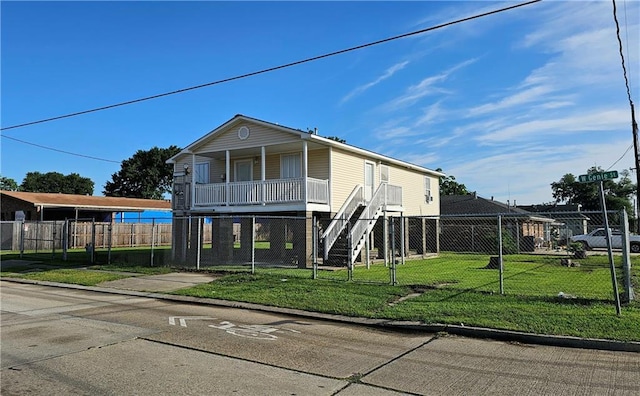 view of front facade with covered porch and a front yard