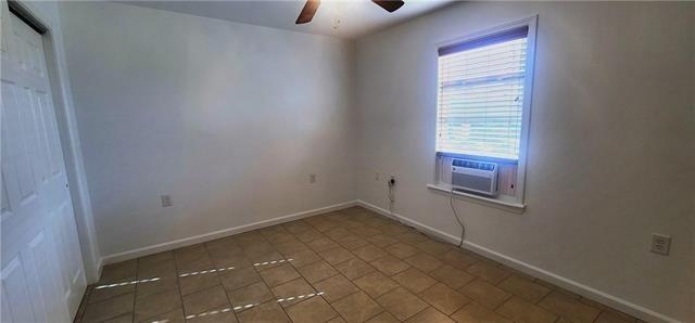 spare room featuring ceiling fan