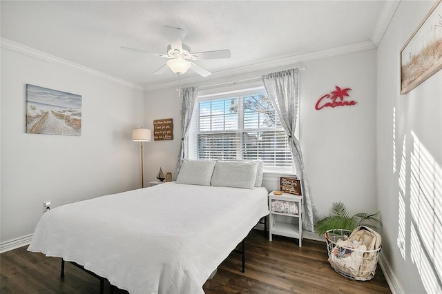 bedroom with dark hardwood / wood-style floors, ceiling fan, and crown molding