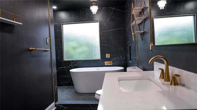 bathroom featuring vanity, toilet, and ornamental molding