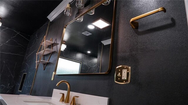 bathroom with a bathtub, a healthy amount of sunlight, and tile walls