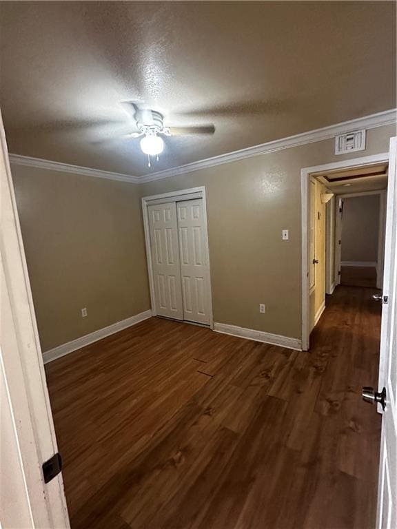 4600 Gawain Dr, New Orleans, LA 70127 - unfurnished bedroom with dark wood-type flooring, visible vents, and ornamental molding