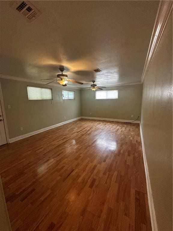 4600 Gawain Dr, New Orleans, LA 70127 - unfurnished room featuring crown molding, visible vents, and wood finished floors