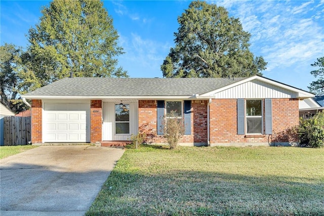 ranch-style home featuring a front lawn and a garage