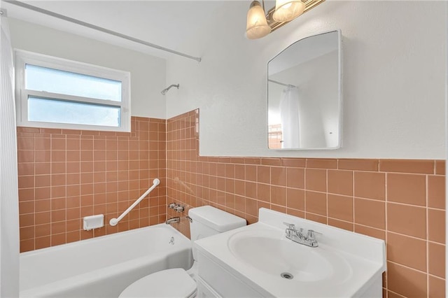 full bathroom with vanity, shower / bathtub combination with curtain, tile walls, and toilet