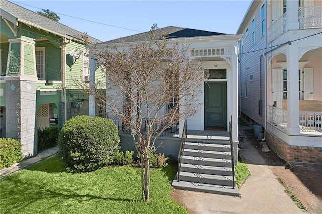 doorway to property featuring a yard