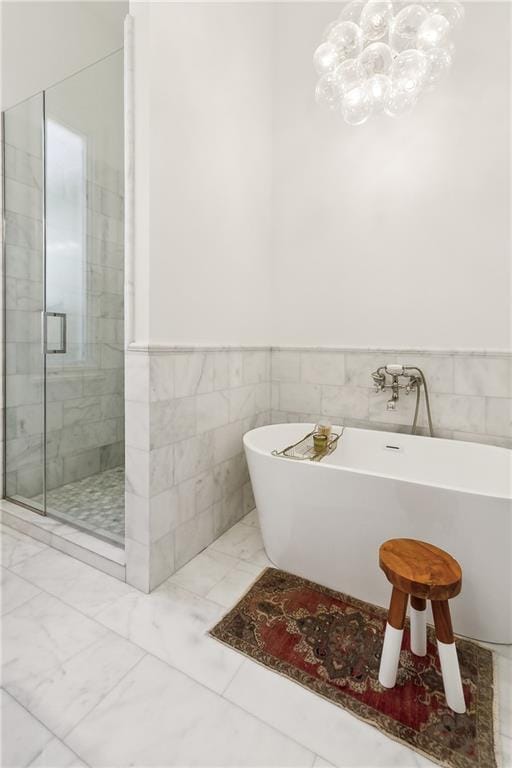 bathroom with plus walk in shower and tile walls