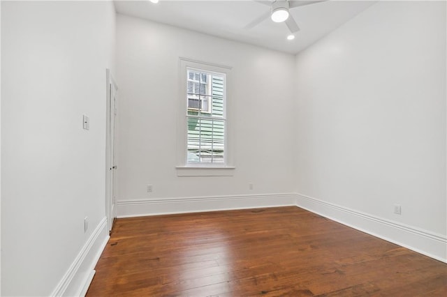 unfurnished room with ceiling fan and dark hardwood / wood-style floors