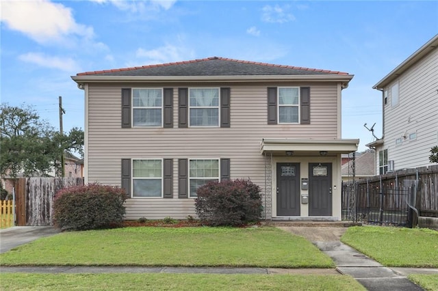 view of property with a front lawn