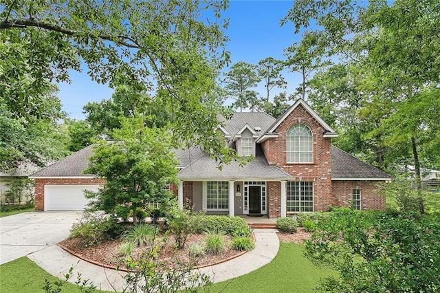 view of front of property with a garage and a front yard