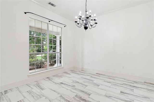 spare room with a chandelier