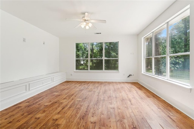 spare room with ceiling fan and light hardwood / wood-style floors