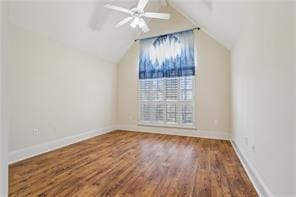 bonus room with ceiling fan, dark hardwood / wood-style flooring, and lofted ceiling