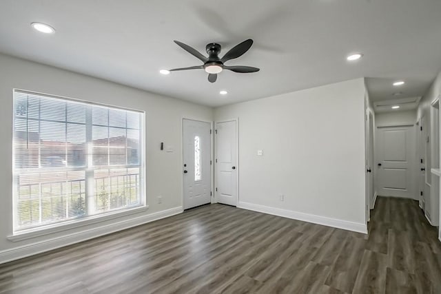 entrance foyer with ceiling fan, dark hardwood / wood-style flooring, and a healthy amount of sunlight