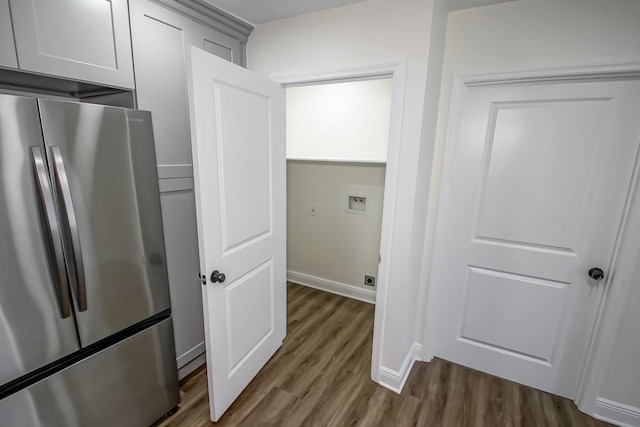 kitchen with dark hardwood / wood-style floors and stainless steel refrigerator