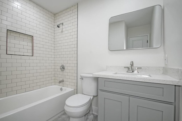 full bathroom with vanity, toilet, and tiled shower / bath