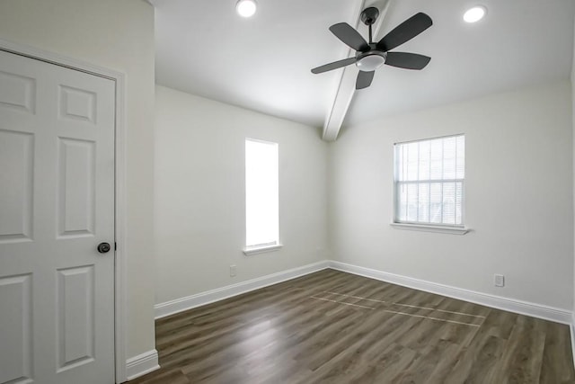 spare room featuring ceiling fan, beamed ceiling, and dark hardwood / wood-style floors