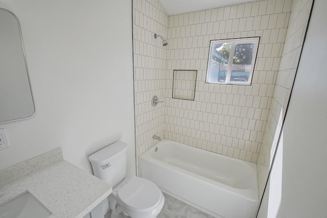 bathroom featuring toilet and tiled shower / bath